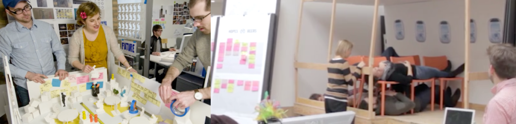 People modeling scenarios with paper, tape of a channel experience. Anothr model is of people using chairs to simulate an airplane expereince.